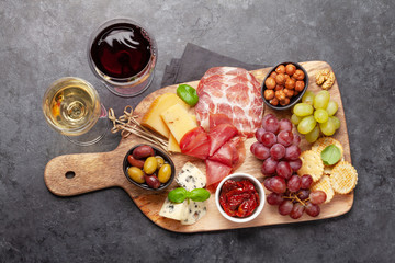 Wall Mural - Cheese, meat, grapes and olives antipasto