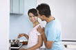 © ImageHit - Man and woman cooking in the kitchen