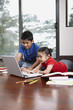 © ImageHit - Boy and girl using laptop together