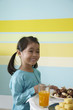 © ImageHit - Girl in traditional clothing smiling