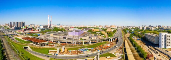 Wall Mural - Power plant pipes and cooling towers in Moscow from above, automobile traffic and the old Ugreshskaya railway station in the Moscow industrial zone near the automobile ring highway