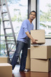 © ImageHit - Man moving cardboard box