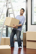© ImageHit - Man carrying cardboard box