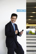 © ImageHit - Businessman with smart phone in hand, cheering
