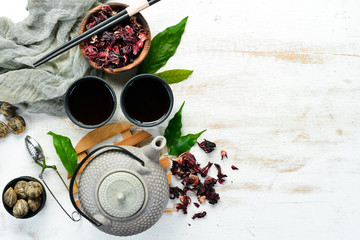 Wall Mural - Assortment of tea, cups and teapots on white wooden background. Chinese Tea Ceremony. Top view. free space for your text.