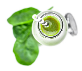 Wall Mural - Homemade spinach smoothie isolated on white (close up; selective focus)