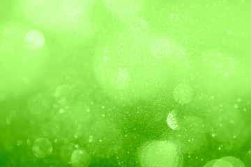 Poster - Glittery bokeh pattern on a green background