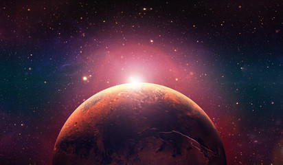 Mars the red planet. Sunset on mars.  Red planet in the space full of stars.