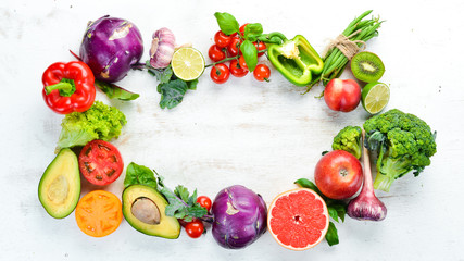 Fresh raw vegetables on a white background Wooden. Top view. Free space for your text.