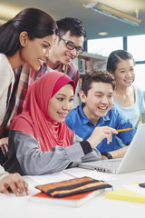 Wall Mural - Students studying together in library