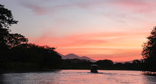Pink Sky At Sunset On The Rio Frio River In Costa Rica