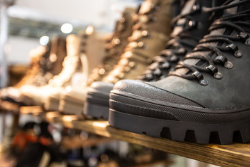 Close up photo with selective focus of military berets boots in the army shop