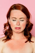 Sad woman with sunburnt skin