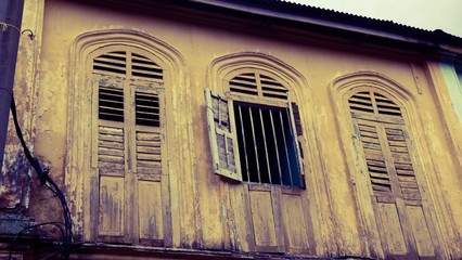 Wooden wall with concrete wall of a building