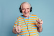 © rawpixel.com - Happy senior man dancing while listening to music with headphones