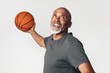 © rawpixel.com - Senior coach holding a basketball