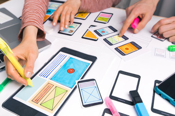 Teamwork of website designers. Development of sketch interfaces for mobile phone applications. Brainstorming and discussion of ideas.