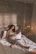 © Impact Photography - Pregnant woman reading in bed