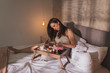 © Impact Photography - Pregnant woman having breakfast in bed