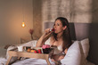 © Impact Photography - Pregnant woman eating strawberries for breakfast