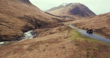 Sweeping Shot Reveals Dramatic Landscape That Land Rover Defender Is Travelling Through, Scotland