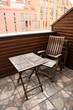 © LIGHTFIELD STUDIOS - wooden chair and table on modern balcony