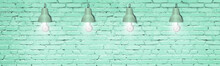 Mint Green Painted Brick Wall With Lamps. Modern Interior Decorative Lighting