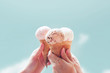 © oatawa - Young woman hands holding ice cream cones on sky summer background