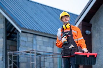 Aufkleber - Electrician working with tool at the construction site,House and house reconstruction.