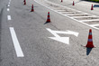 car road marking with cones to control the direction of movement