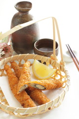 Wall Mural - Japanese food, Shishamo deep fried and lemon in bamboo basket