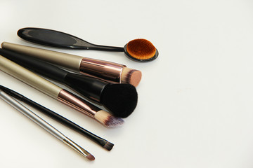 Wall Mural - makeup artist set, different makeup brushes on a white background