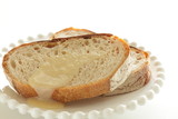 Fototapeta Storczyk - Condensed milk and French bread for breakfast