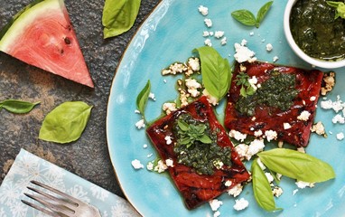 Sticker - Grilled watermelon with goat cheese and pesto sauce. dish of watermelon.  top view.