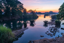 Beautiful Landscape View Of Sunrise And Old Wooden Boat Drop Nearly The River In Front Of Guest House From Don Det The Famous Place For Tourist To Relaxing At Siphondon Island, Laos.