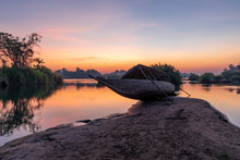 Beautiful Landscape View Of Sunrise And Old Wooden Boat Drop Nearly The River In Front Of Guest House From Don Det The Famous Place For Tourist To Relaxing At Siphondon Island, Laos.