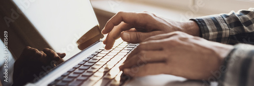 Fotomural Man hands typing on computer keyboard closeup, businessman or student using lapt