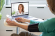 © Melinda Nagy - telemedicine concept elderly woman speaking to her doctor online and taking her blood pressure