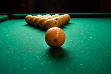 pyramid of billiard balls on the billiard table