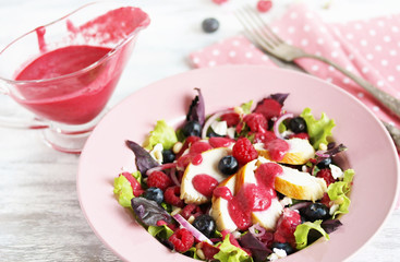 Wall Mural - Salad with berries and chicken breast, seasoned with berry vinaigrette. Berry Vinaigrette Dressing