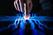 © Gorodenkoff - Digitalization Concept: Human Finger Pushes Touch Screen Button and Activates Futuristic Artificial Intelligence. Visualization of Machine Learning, AI, Computer Technology Merge with Humanity