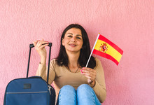 Woman With Travel Bag And Flag Of Spain