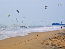 Kites Flying Over Sea Against Clear Sky