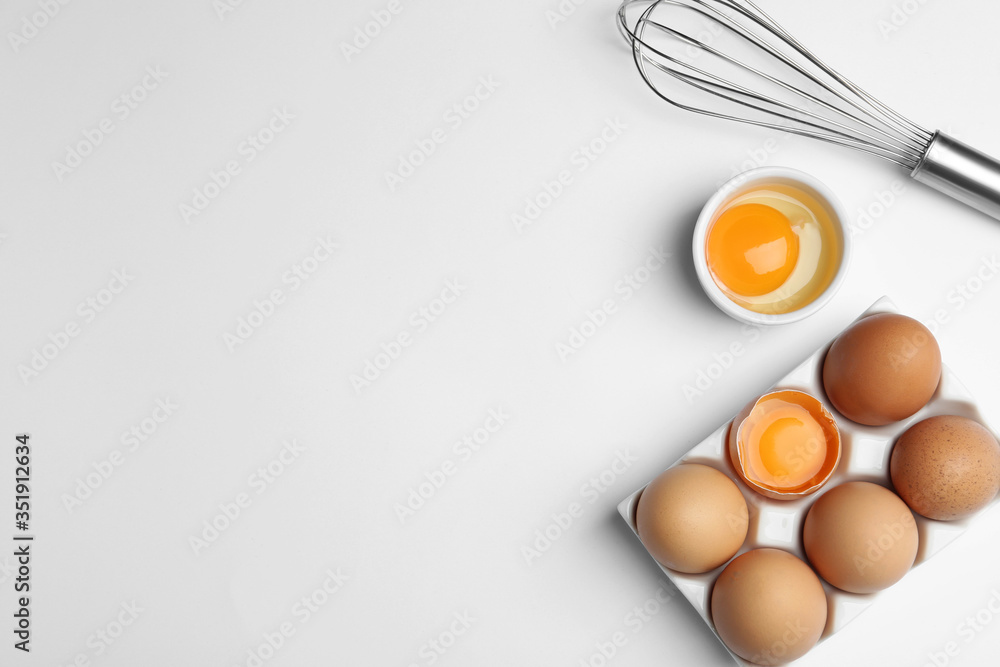 Flat lay composition with chicken eggs on white background. Space for text - obrazy, fototapety, plakaty 