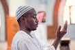 © FS-Stock - Religious black muslim man praying inside the mosque
