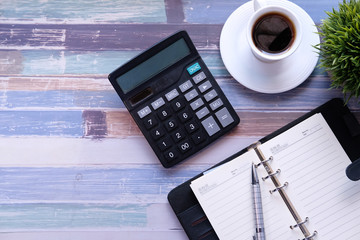 Sticker - Top view of calculator, notepad and tea on desk 