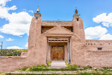 Las Trampas San Jose De Gracia Church On High Road To Taos Village With Historic Vintage Adobe Style Building In New Mexico With Door Gate Entrance And Cross