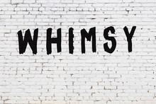 Word Whimsy Painted On White Brick Wall