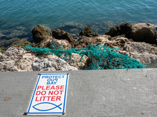 Protect Our Bay Signage And Fishing Net Litter.
