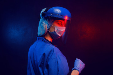 Sticker - female doctor in medical mask on the face and gloves on a dark background